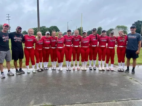 a group of people in red uniforms
