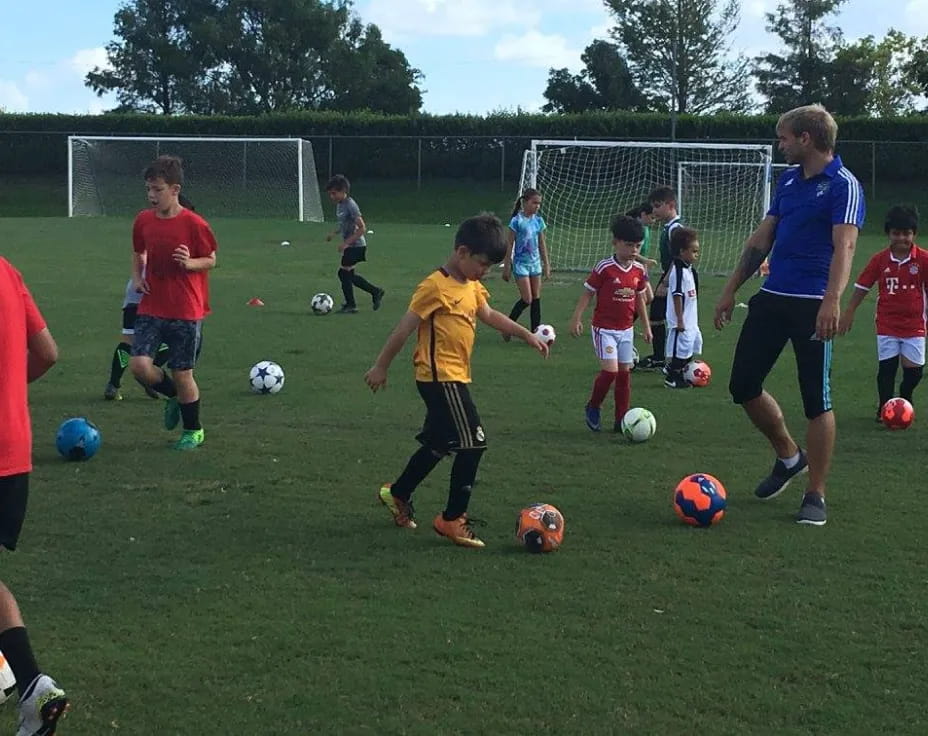 a group of kids playing football