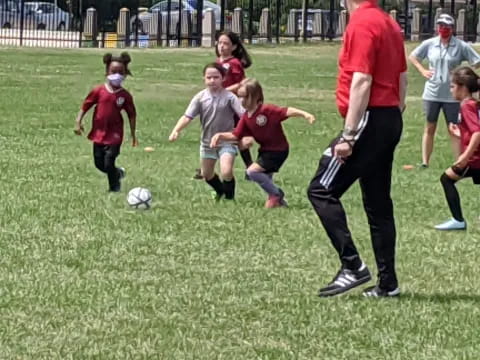 a group of kids playing football