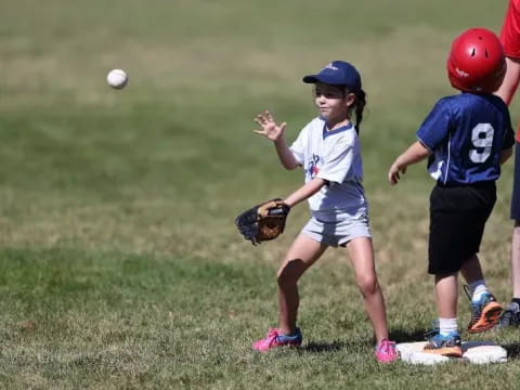 a group of kids playing baseball