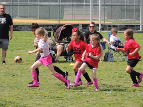 a group of girls playing football