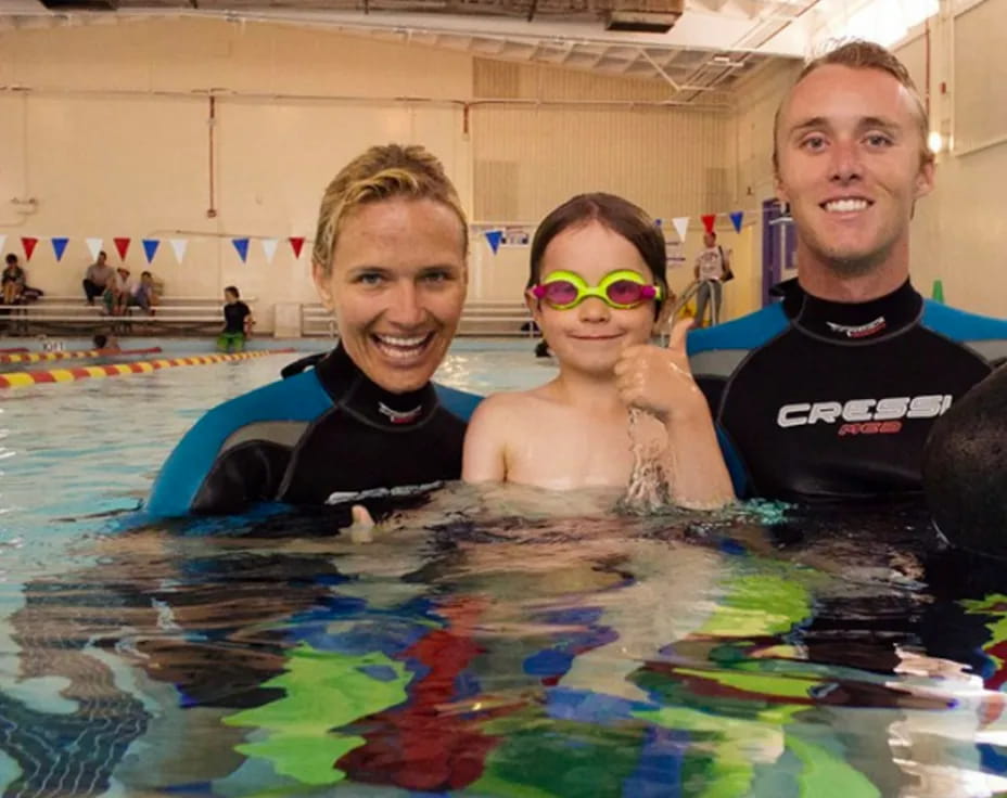 a group of people in a pool