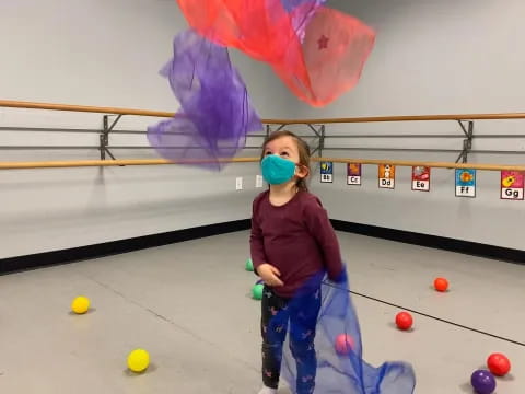 a girl playing a game of bowling