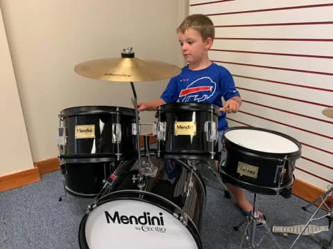 a boy playing drums