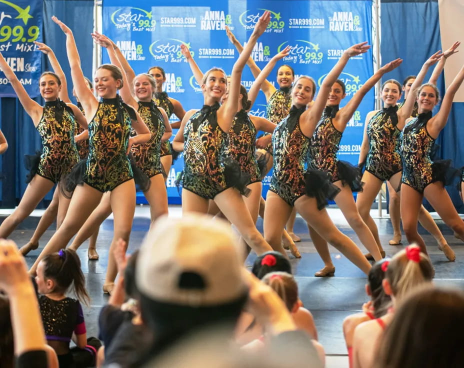 a group of women dancing on a stage