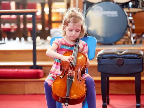 a girl playing a violin