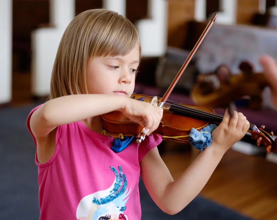a girl playing a violin