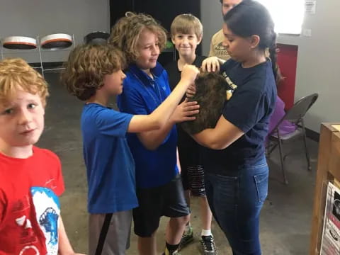 a group of kids holding a ball