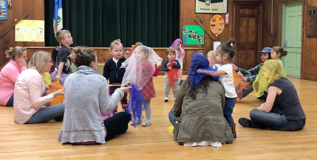a group of children sitting on the floor