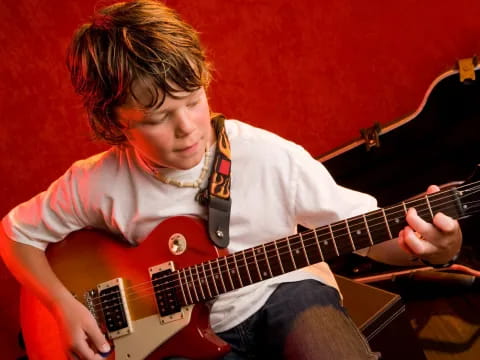 a person playing a guitar