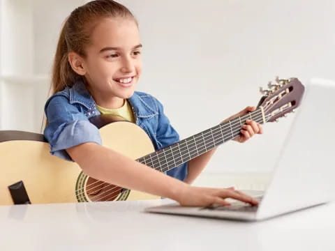 a girl playing a guitar