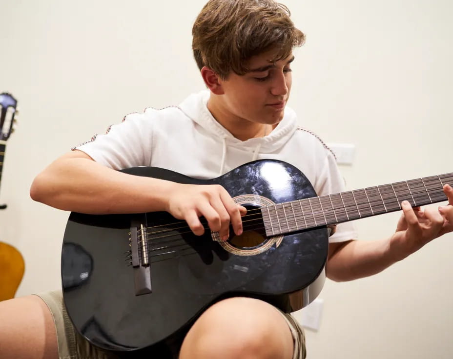 a person playing a guitar