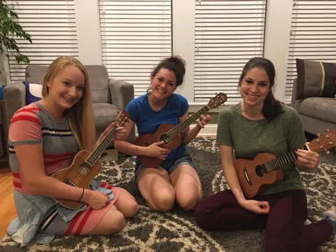 a group of women holding guitars