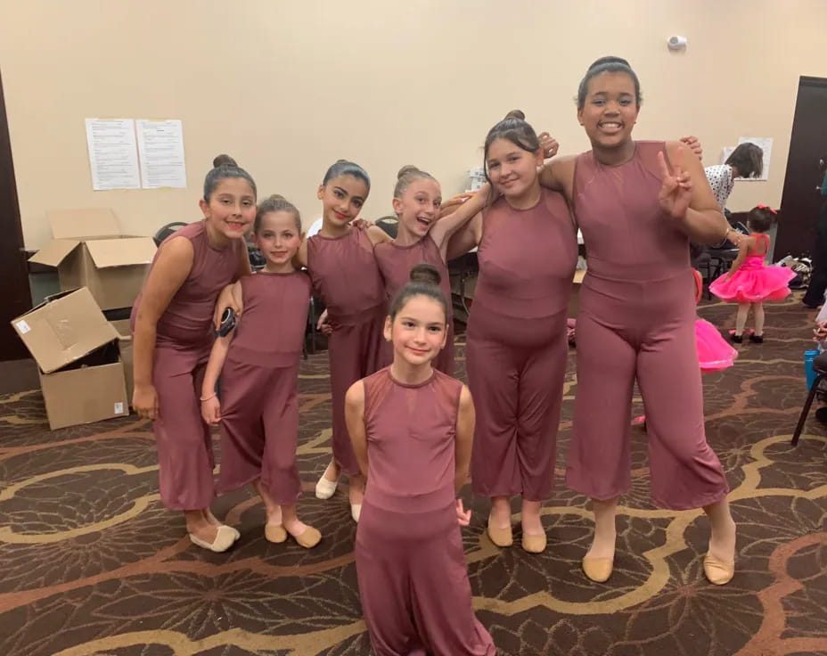 a group of women in pink
