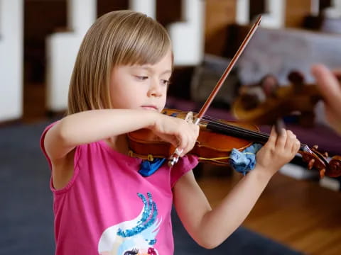 a girl playing a violin