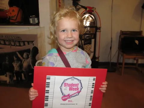a child holding a box
