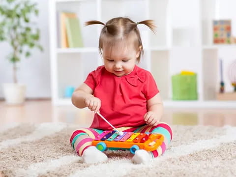 a baby playing with a toy