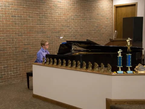a person standing next to a piano