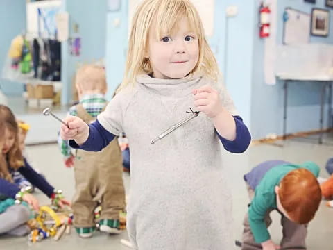 a girl in a grey sweater