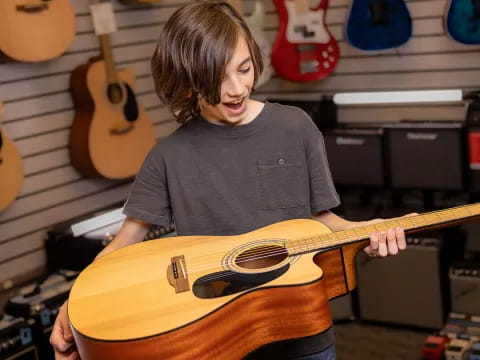 a person holding a guitar