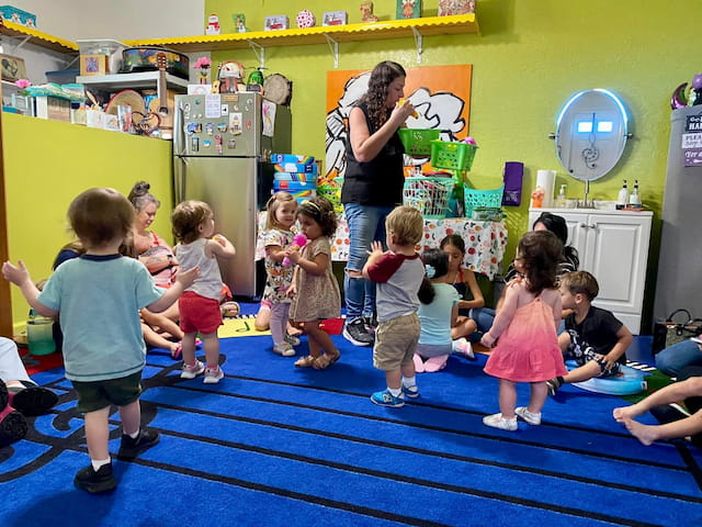 a person teaching children in a classroom