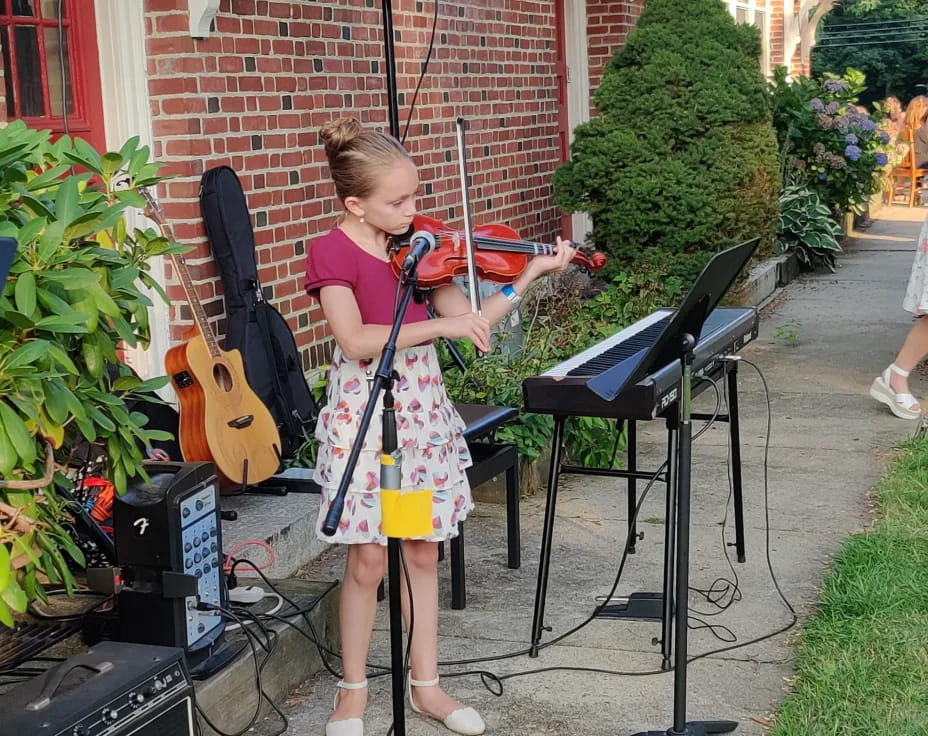 a girl playing a musical instrument