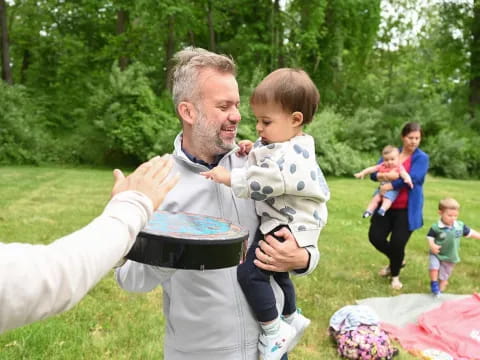 a man holding a baby