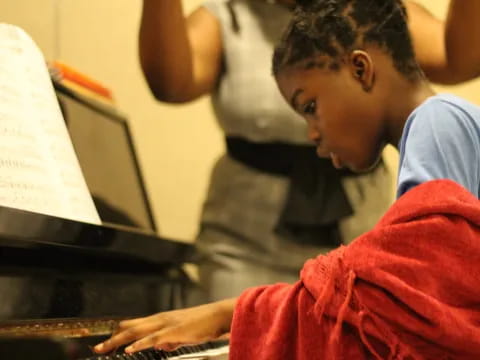 a young boy working on a laptop
