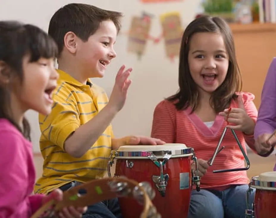 a group of kids playing drums