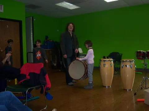 a group of people playing drums