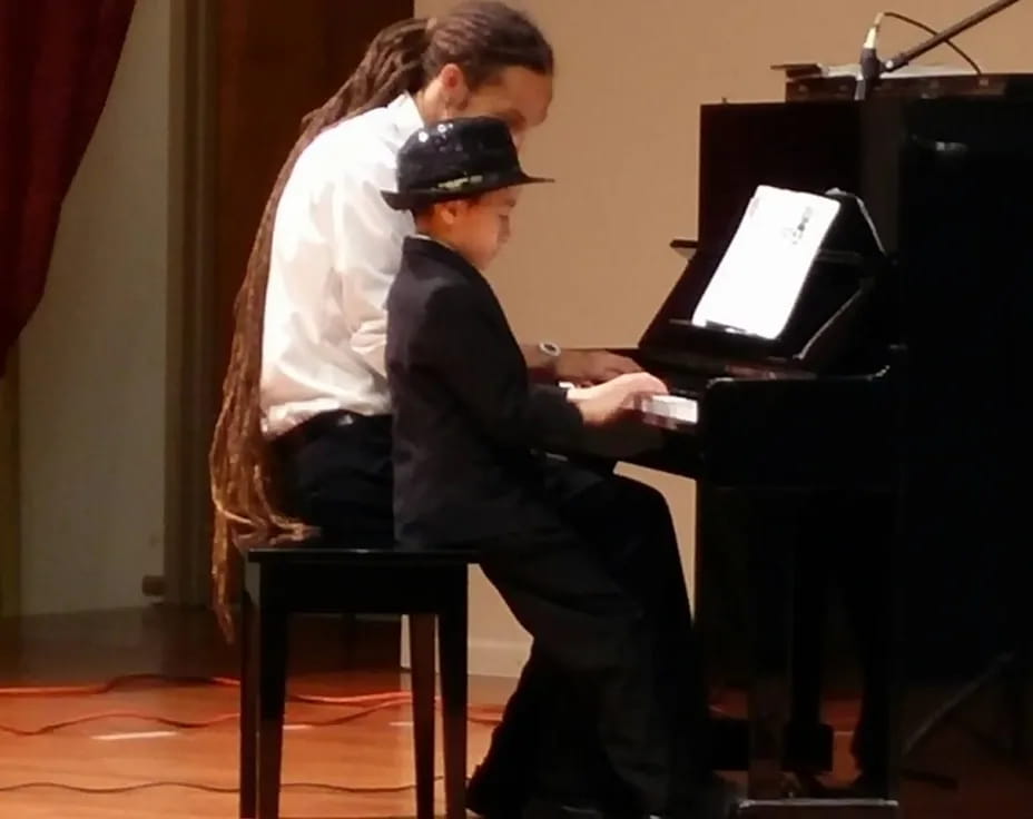 a man playing a piano