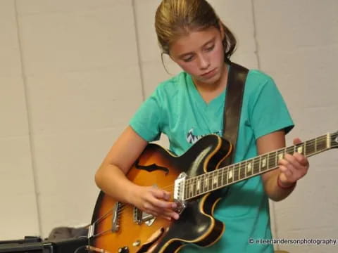 a person playing a guitar