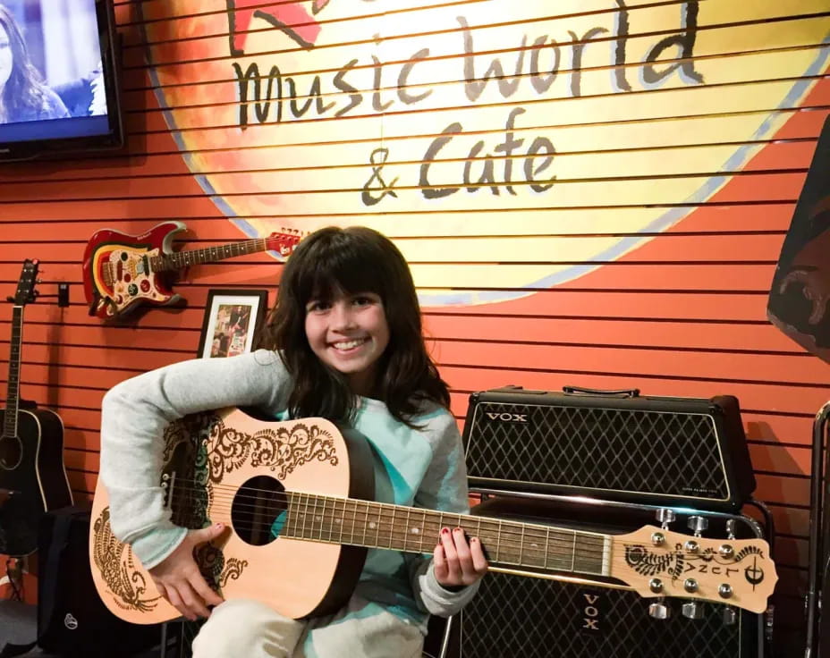 a person holding a guitar