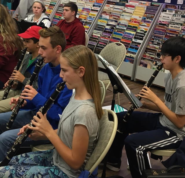 a group of people playing instruments