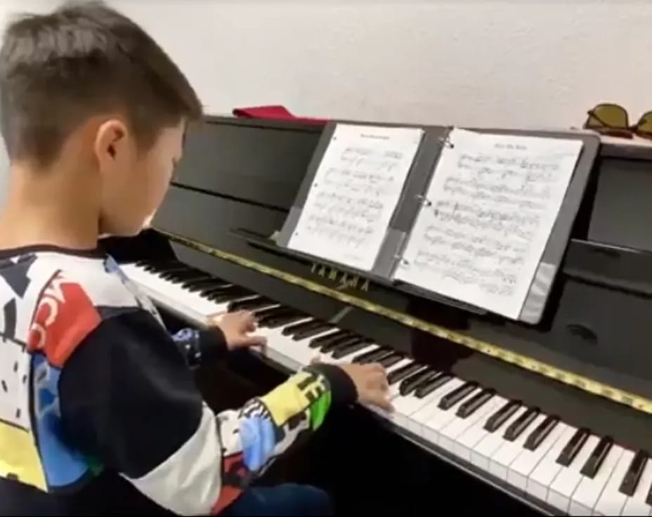 a child playing a piano