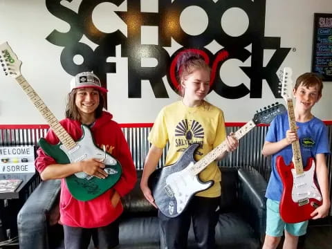 a group of people holding guitars