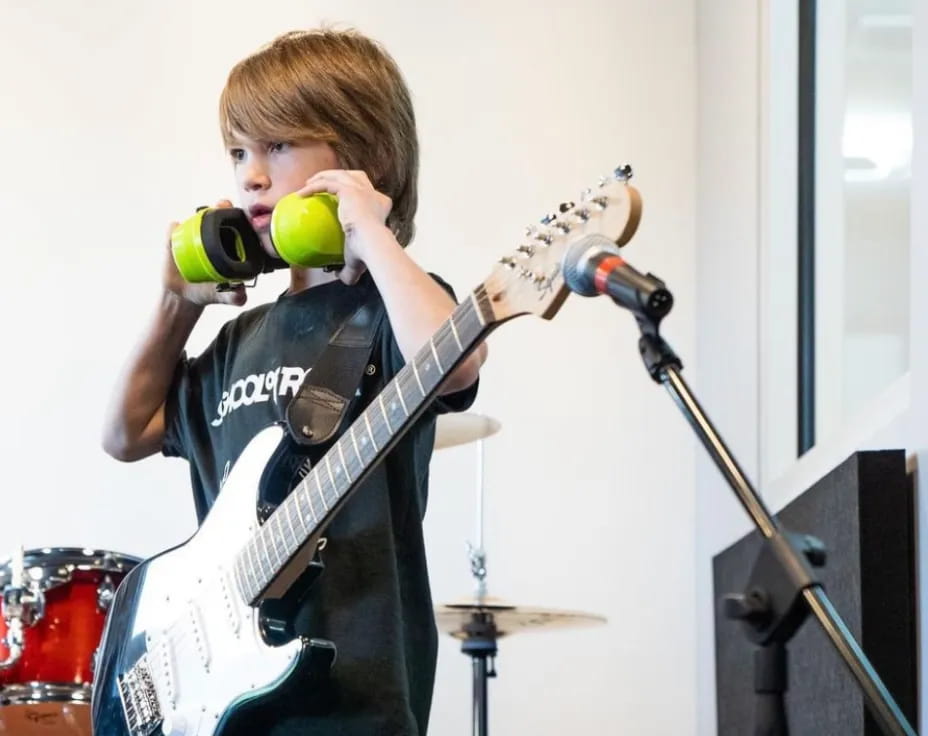 a boy playing a guitar