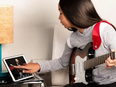 a person playing a guitar