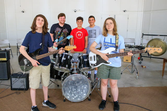 a group of people holding instruments