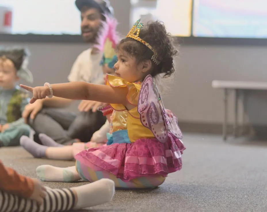 a young girl in a colorful dress