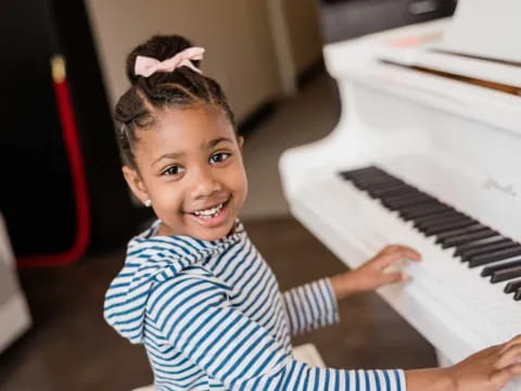 a child playing a piano