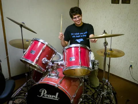 a person playing a drum set