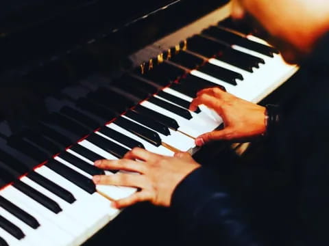 a person playing a piano