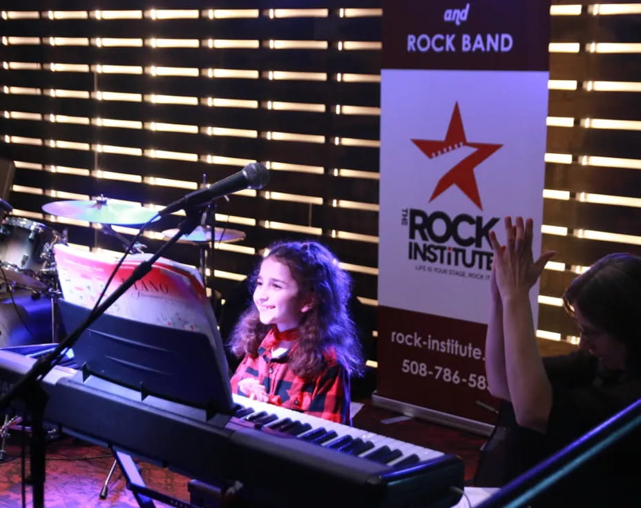 a person sitting at a piano