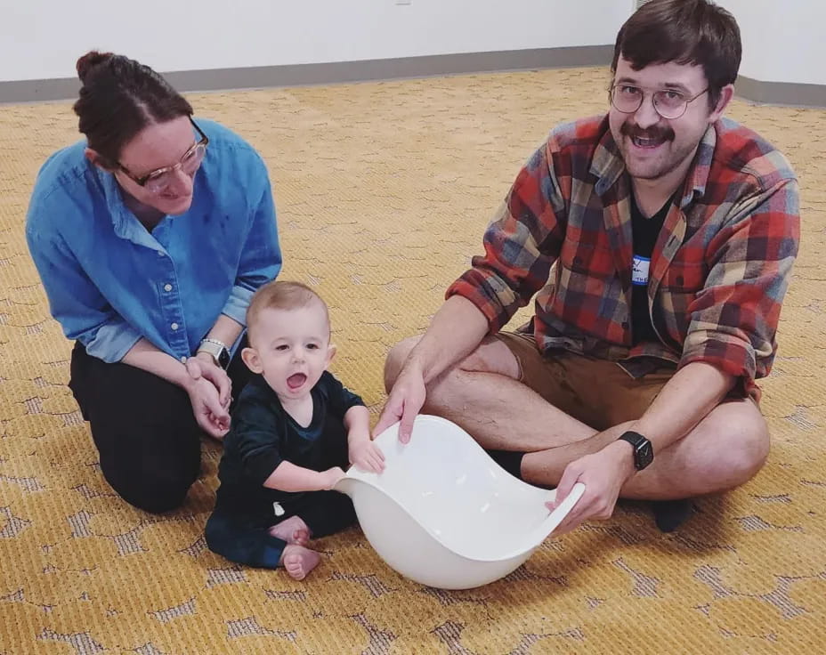 a man and a woman with a baby