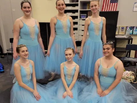 a group of women in dresses
