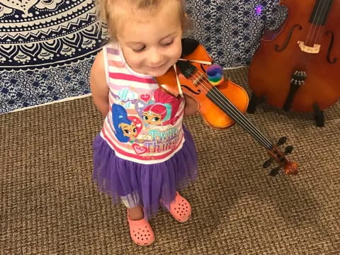 a little girl playing with a toy