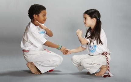 a man and a woman kneeling on the ground
