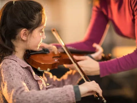 a person playing a violin