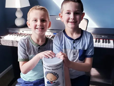 two boys sitting on a couch